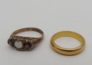 A 22CT GOLD BAND RING AND A GARNET AND OPAL SET SILVER RING 22ct gold band ring: 5.8 grams Opal