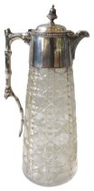 A SILVER MOUNTED LATE VICTORIAN CLARET JUG, tapered circular form, the cut glass body mounted with