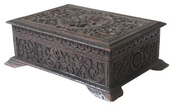 AN ANGLO INDIAN CARVED SANDALWOOD BOX, EARLY 20TH CENTURY, rectangular form, the hinged lid carved