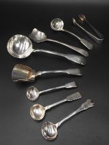 TWO 19TH CENTURY SILVER SALT SHOVELS, SUGAR TONGS AND SAUCE LADLE, along with four salt spoons 18 cm