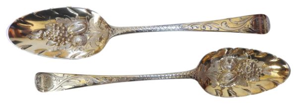 A PAIR OF GEORGE III SILVER BERRY SPOONS, with bright cut scroll foliate decorated handles and