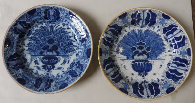 TWO DELFT 'PEACOCK' DISHES, LATE 18TH / EARLY 19TH CENTURY, both with yellow overglaze painted rims,