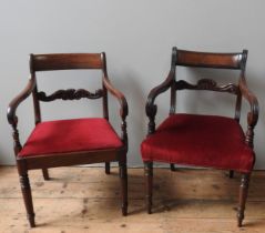 A SET OF SIX REGENCY MAHOGANY DINING CHAIRS, WITH FLORAL AND LYRE CARVED CROSS BACK, DROP IN SEAT