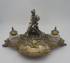 A 19TH CENTURY SILVER PLATED INK STAND, the ornate shell decorated rocaille stand surmounted by