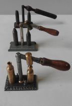 THREE VINTAGE CARTRIDGE CAPPERS/DECAPPERS, two with turned wooden handles 9 cm high max