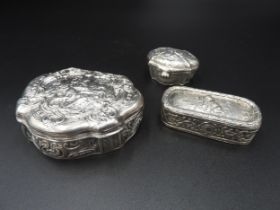 A GERMAN SILVER TRINKET BOX AND TWO SMALLER BOXES, cartouche and rectangular form, all with