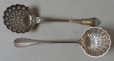 TWO VINTAGE FRENCH SILVER SUGAR SIFTING SPOONS, both with shell form bowls, one with a fiddle and