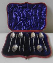 A SET OF SIX LATE VICTORIAN TEASPOONS AND SUGAR TONGS, the spoons surmounted with apostle figures,