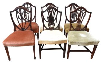 TWO PAIRS OF MAHOGANY BALLOON BACK DINING CHAIRS, 19TH CENTURY, shield form with intricate carved