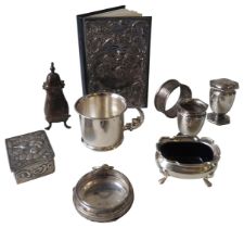 A GROUP OF VARIOUS SILVER WARES, the lot comprised of a silver fronted address book, repousse