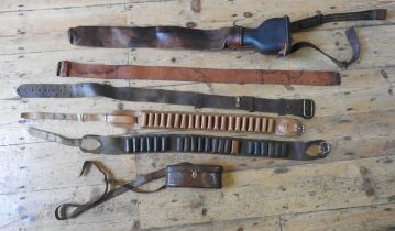 A GROUP OF VINTAGE LEATHER SHOOTING WARES, the lot comprised of a kidney shape cartridge bag, two