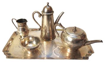 A MINIATURE SILVER TEA SERVICE ON TRAY, the service comprising of a coffee pot, teapot, milk jug and