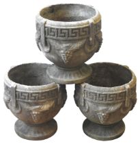 THREE RECONSTITUTED STONE GARDEN PLANTERS, greek key decorated rims, the sides decorated with