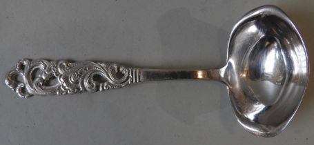 A NORWEGIAN SILVER LADLE, with an elegant pierced rocaille chased handle, marked NM, 20  16 cm