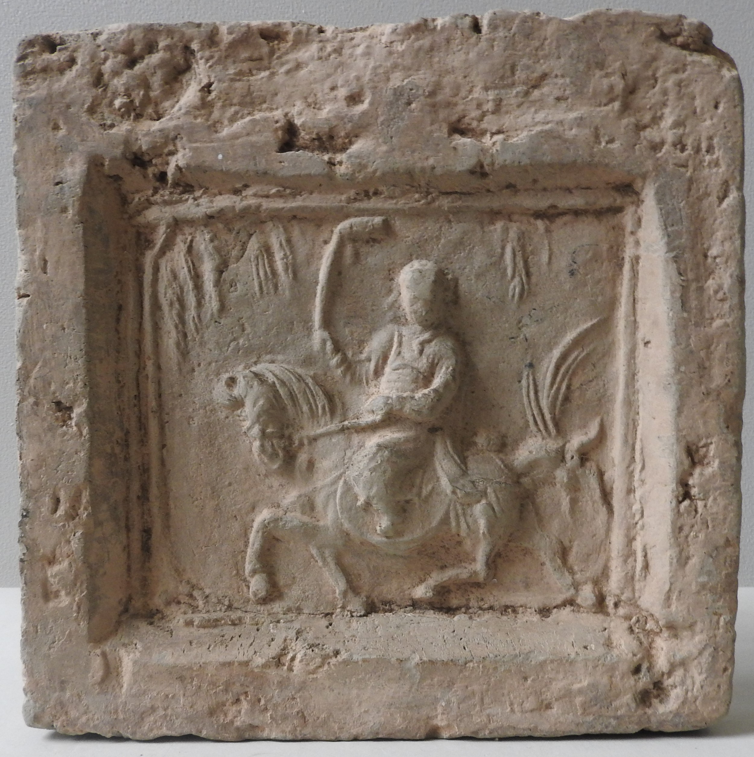 A CHINESE STONE TOMB TILE, the square tile decorated in low relief depicting a polo player on - Image 2 of 3