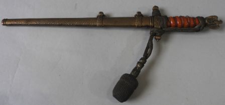 A GERMAN SECOND WORLD WAR NAZI KRIEGSMARINE DAGGER, with eagle surmounted pommel, burnt orange