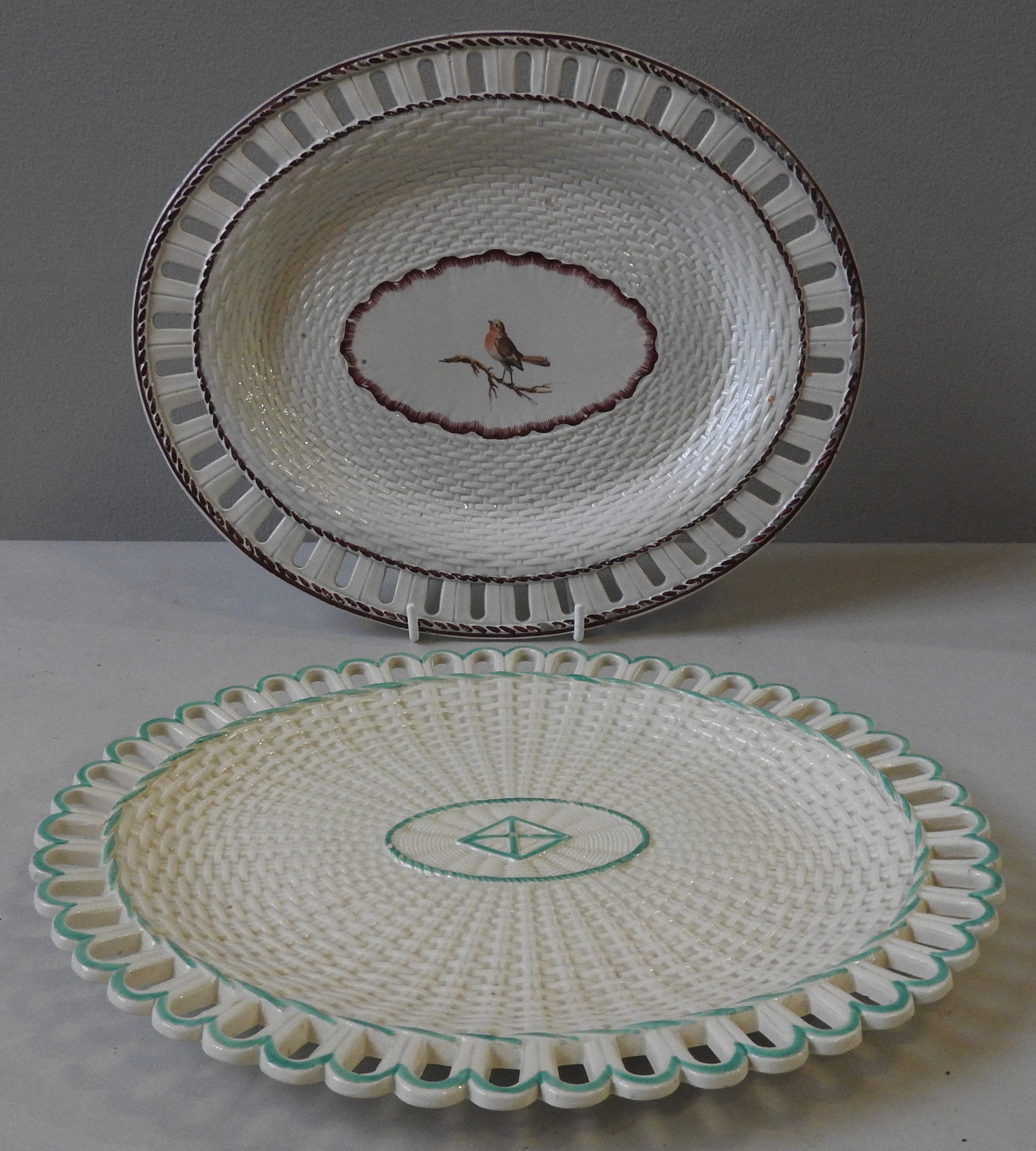 TWO RETICULATED CREAM WARE OVAL PLATTERS, EARLY 19TH CENTURY, one Wedgwood example with basket weave