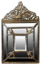 A 19TH CENTURY CUSHION MIRROR, brass embossed 94 x 59 x 6 cm