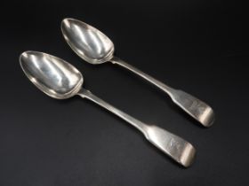 A PAIR OF GEORGE III SILVER SERVING SPOONS, fiddle pattern with engraved stag insignia, marked