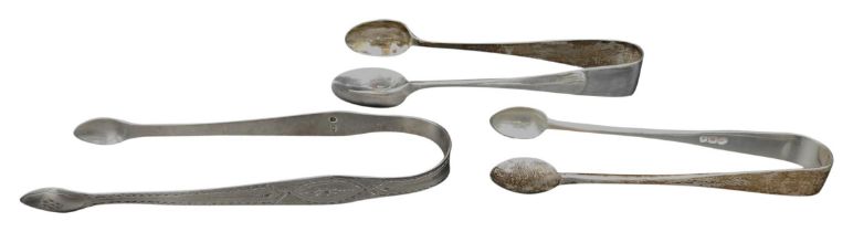 THREE PAIRS OF SILVER SUGAR TONGS, the lot comprised of a George III pair marked Thomas Oliphant,