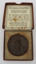 A CAST IRON RMS LUSITANIA MEDAL, boxed.  5.5 cms