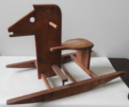 A BESPOKE HANDMADE ROCKING HORSE BY PETER MARKEY (1930-2016), renowned automata maker and painter,