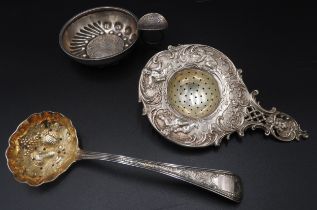 AN 18TH CENTURY WHITE METAL TASTEVIN CUP, DUTCH WHITE METAL STRAINER AND A GEORGIAN SILVER BERRY