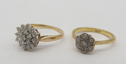 A CONTEMPORARY DIAMOND CLUSTER RING AND A VINTAGE DIAMOND CLUSTER RING, the vintage ring with a