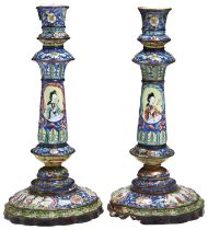 PAIR OF CANTON ENAMEL CANDLESTICKS QIANLONG PERIOD (1736-1795) decorated in coloured with elegant