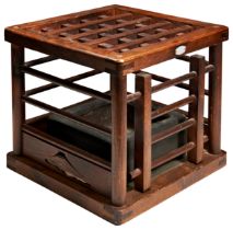 A JAPANESE WOODEN KOTATSU LATE MEIJI / TAISHO P[ERIOD  with a pottery coal tray 33cm wide