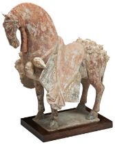 A VERY FINE CHINESE UNGLAZED POTTERY CAPARISONED STANDING HORSE LATE NORTHERN WEI / NORTHERN QI,