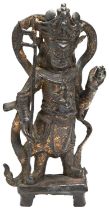 A GILT BRONZE FIGURE OF VIRUPAKSHA, THE GUARDIAN-KING OF THE WEST MING DYNASTY (1368-1644) modelled