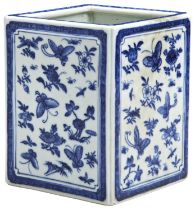 A BLUE AND WHITE SQUARE SECTION BRUSHPOT QING DYNASTY, 19TH CENTURY the sides painted in tones of