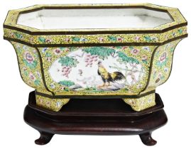 A CANTON ENAMEL YELLOW-GROUND JARDINIERE EARLY 20TH CENTURY the sides decorated in coloured