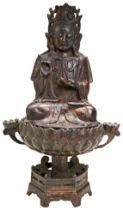 A BRONZE FIGURE OF GUANYIN ON A LOTUS BASE MING DYNASTY (1368-1644) the bodhisattva is seated in