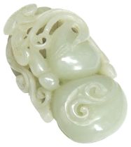 A CELADON JADE CARVING 19TH / 20TH CENTURY carved with peach and lingzhu fungus 6.5cm long