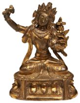 A GILT-BRONZE FIGURE OF MANJUSRI QING DYNASTY, 18TH CENTURY the well cast figure shown seated in