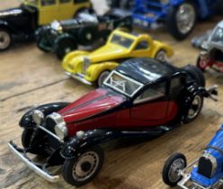 COLLECTION OF 1930S MODEL CARS Includes several models by Bugatti and others, such as a 1:18 scale