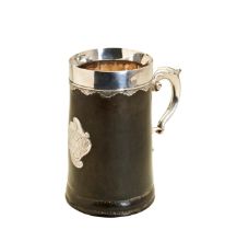 A SILVER MOUNTED "BLACK JACK" MUG, C. 1760. A leather "black jack" mug with silver handle, rim and