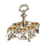 AN ANGLO-INDIAN EGG CRUET WITH SIX EGG CUPS, CALCUTTA C.1830. An egg cruet frame with a cast florate