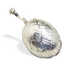 A SHELL BOWL CADDY SPOON, POSSIBLY DUTCH C.1770. A rather large caddy spoon with a curved acanthus