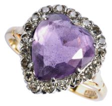 AN AMETHYST AND DIAMOND DRESS RING the heart-shaped amethyst claw set within a heart-shaped bezel