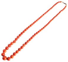 A CORAL NECKLACE, CIRCA 1890 the graduating row of red coral beads on a 9 carat gold barrel