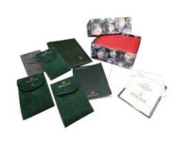 ROLEX ACCESSORIES a Red Leather Rolex Watch Box in cardboard outer box and four Rolex soft cases and