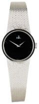 EBEL: AN 18CT WHITE GOLD LADIES WRISTWATCH signed black dial, dauphine hands, the circular case with