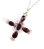 A GARNET AND SEED PEARL PENDANT, CIRCA 1890 set with four pear-cut garnets and an oval-cut garnet in