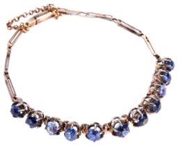 A LATE 19TH / EARLY 20TH CENTURY GOLD AND SAPPHIRE BRACELET, CIRCA 1890 the eleven mixed-cut