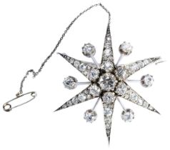 A LATE VICTORIAN DIAMOND STAR BROOCH, CIRCA 1890 the old brilliant-cut diamond, cut down collet