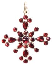 A GARNET PENDANT, CIRCA 1880 of elaborate cross design, set with pear and circular mixed-cut