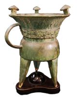A CHINESE CELADON GLAZED TRIPOD RITUAL VESSEL, 20TH CENTURY, upon a wooden base **PLEASE NOTE: